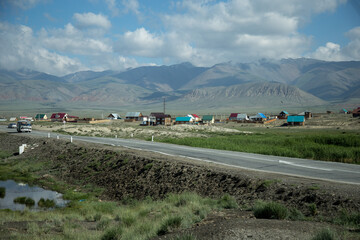 Traveling in the Altai Republic. The plot of the Chuysky tract. The city of Kosh-Agach. Local Russian village with a national lifestyle