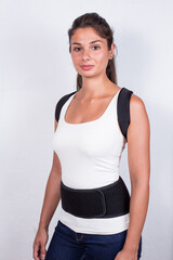 Instruction how to wear posture corrector. Different angels. Women wearing back support belt for support and improve posture consists of two parts for the back and lower back. Details, quality