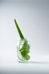 Slice aloe vera and gel on white background