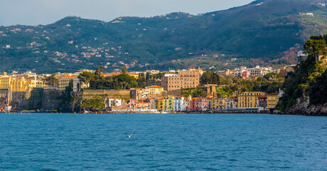 Approaching Piccola Grande Marina from the sea on a sunlight evening in Sorrento, Italy