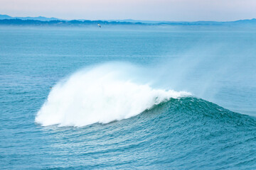 Majestic wave by the lighthouse in Santa Cruz