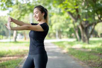 Asian women are stretching their muscles before going out to run to the park to keep themselves...