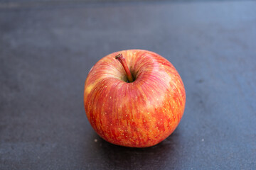 red apple on a dark wooden background