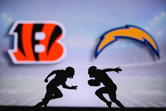 Cincinnati Bengals vs. Los Angeles Chargers. NFL match poster. Two american football players silhouette facing each other on the field. Clubs logo in background. Rivalry concept photo.