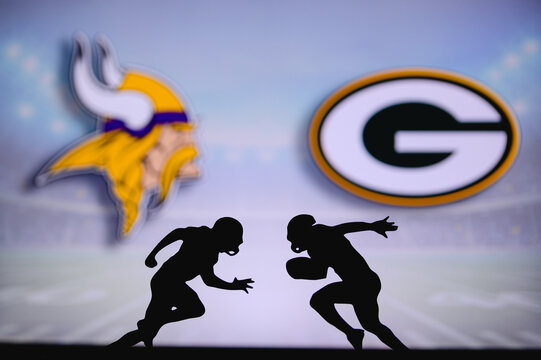 Minnesota Vikings vs. Green Bay Packers. NFL match poster. Two american football players silhouette facing each other on the field. Clubs logo in background. Rivalry concept photo.