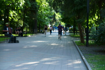 Fototapeta na wymiar people walking in the park
