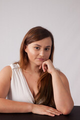 Lovely woman looking thoughtful