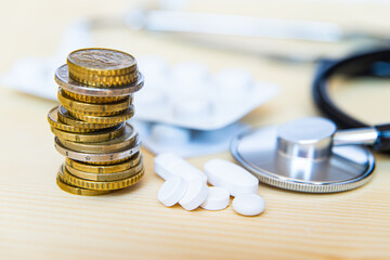 Stethoscope, medicines and coins; health expenditure