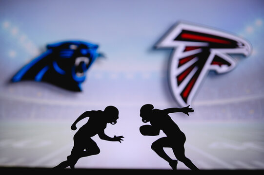 Dallas Cowboys vs. Atlanta Falcons. NFL match poster. Two american football  players silhouette facing each other on the field. Clubs logo in  background. Rivalry concept photo. Stock Photo