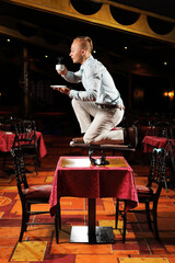 circus performer drink coffee in restaurant