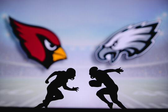 Arizona Cardinals vs. Philadelphia Eagles. NFL match poster. Two american football players silhouette facing each other on the field. Clubs logo in background. Rivalry concept photo.