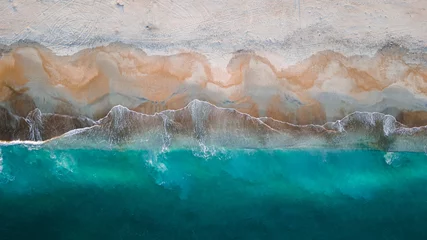 Rolgordijnen Aerial View Above Sandy Beach Seashore of Clear Blue Aqua Waves Breaking on Shore at Dusk Sunset. Beautiful Ocean coast tropical background texture © Lucas