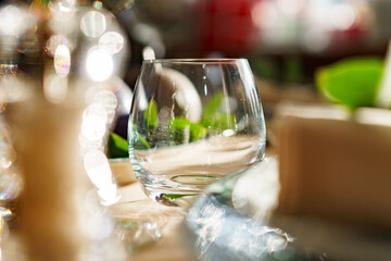 Beautiful elegant table setting with green stylish dishware and silver cutlery