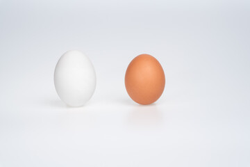 Brown and White eggs on white background