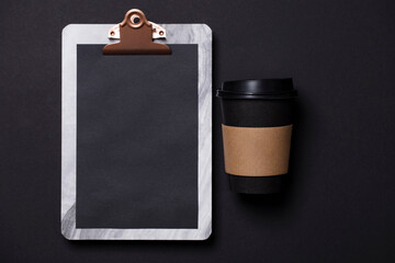 Black take away coffee cup and clipboard blank menu
