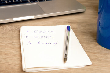 Notepad with daily routine. . Sunny.