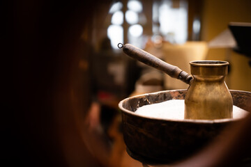 Paper bag turk pouch mock up with coffee beans and spoon turk on wooden background 