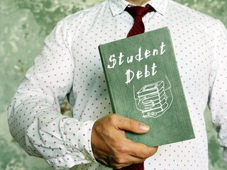 Business concept meaning Student Debt with phrase on the piece of paper.