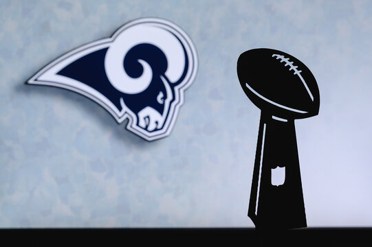 Los Angeles Rams Professional American Football Club, Silhouette Of NFL Trophy, Logo Of The Club In Background.