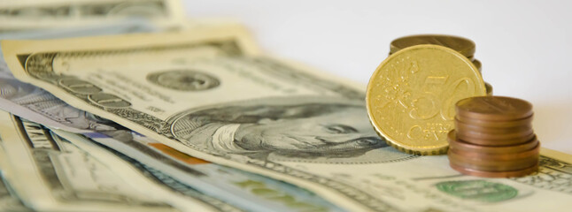  the pen lies on a white background and money. tuition fee. financing