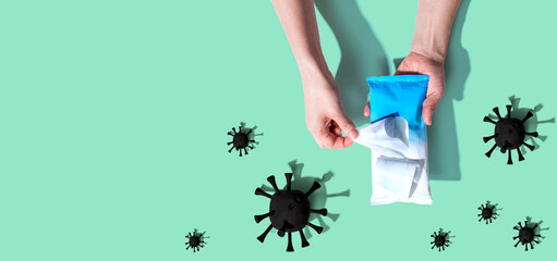 Sanitizer wipe with coronavirus concept - flat lay