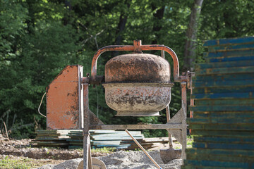 Cement mixer, building supplies and wooden panels