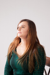Fototapeta premium Pensive woman in a green dress
