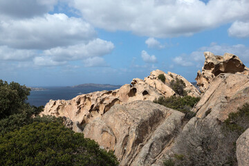 View of the sea and the city of Palau through the bear's rock during a sunny day, north of Sardinia, Italy. 