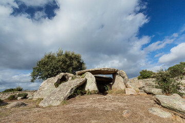 Ancient dolmen of Ladas  during a cloudy day, near Tempio Pausania, north of Sardinia, Italy. 