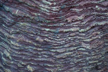 Details of Japanese Zen Garden. Surface of natural uneven volcanic Purple slate stone. Purple slate is the ideal material for standing stone groupings in Japanese gardens. 