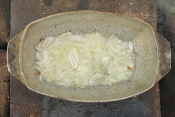 Pilaf in a cauldron with spoon