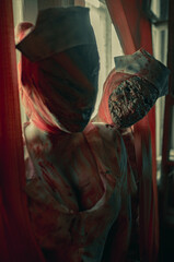 Cosplayers are in image of monsters mannequins.