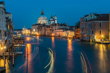 Fototapeta na wymiar View of Basilica di Santa Maria della Salute and grand canal from Accademia Bridge at night in Venice, Italy.