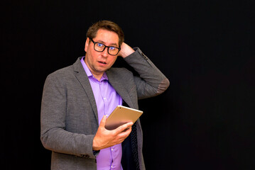 Middle age Business man uses and works with the pc tablet