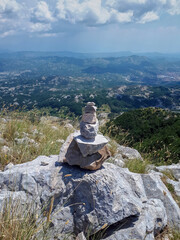 Rock balancing on mountain in Montenegro