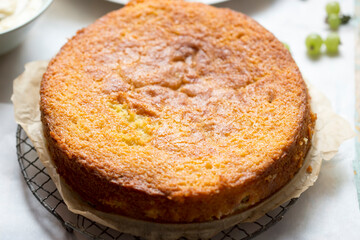 Sticky gooseberry saffron cake with vanilla custard
