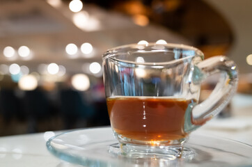 cup of coffee in glass on table