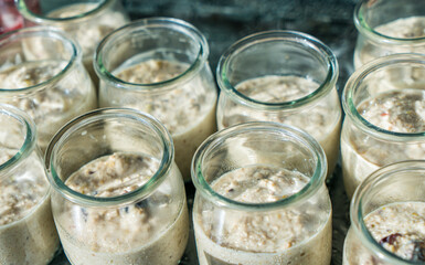 Healty bircher muesli in jars ( Swiss oatmeal)