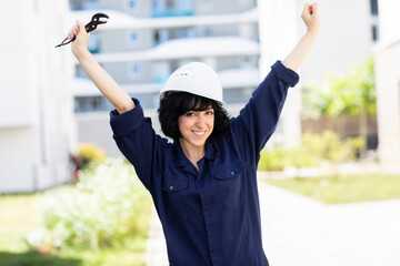 young woman with blue collar and helmet outside