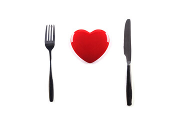 Red heart fork and knife on white background.