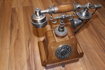 old phone on wooden table