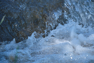 raging mountain river around the stones
