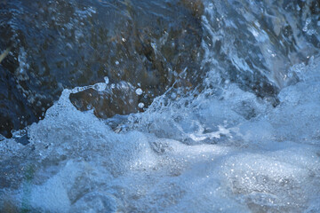 raging mountain river around the stones