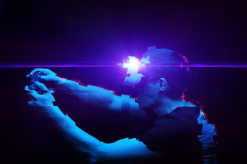 Man with virtual reality headset is playing game. Image with glitch effect.