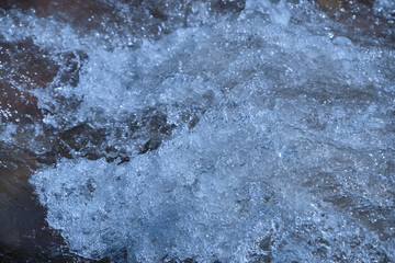 raging mountain river around the stones