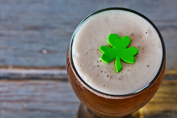 Fototapeta St Patrick's day beer with green shamrock obraz