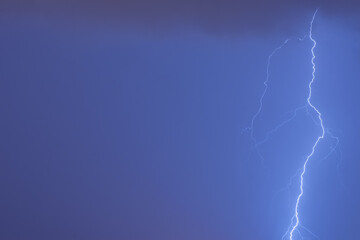 Lightning in the night sky. Copy space