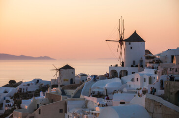 Oia town, on the Greek Santorini island (Thira). Tour of the sunset overlooking the mill