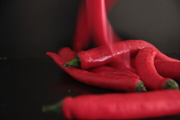 colorful peppers on a black background
