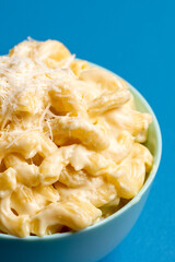 Mac and cheese close-up. Bowl with macaroni and bechamel sauce